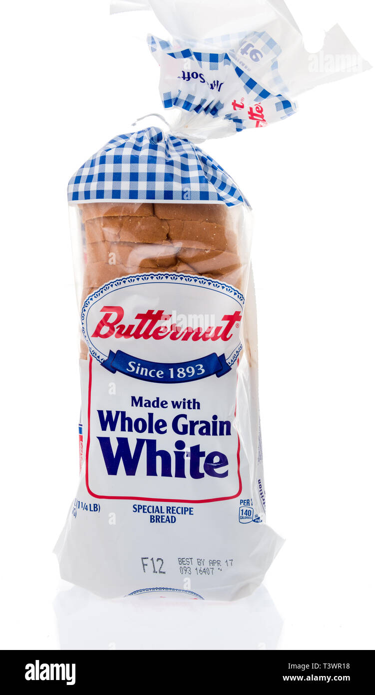 Winneconne, WI -  3 April 2019: A package of Butternut whole grain white loaf bread on an isolated background Stock Photo