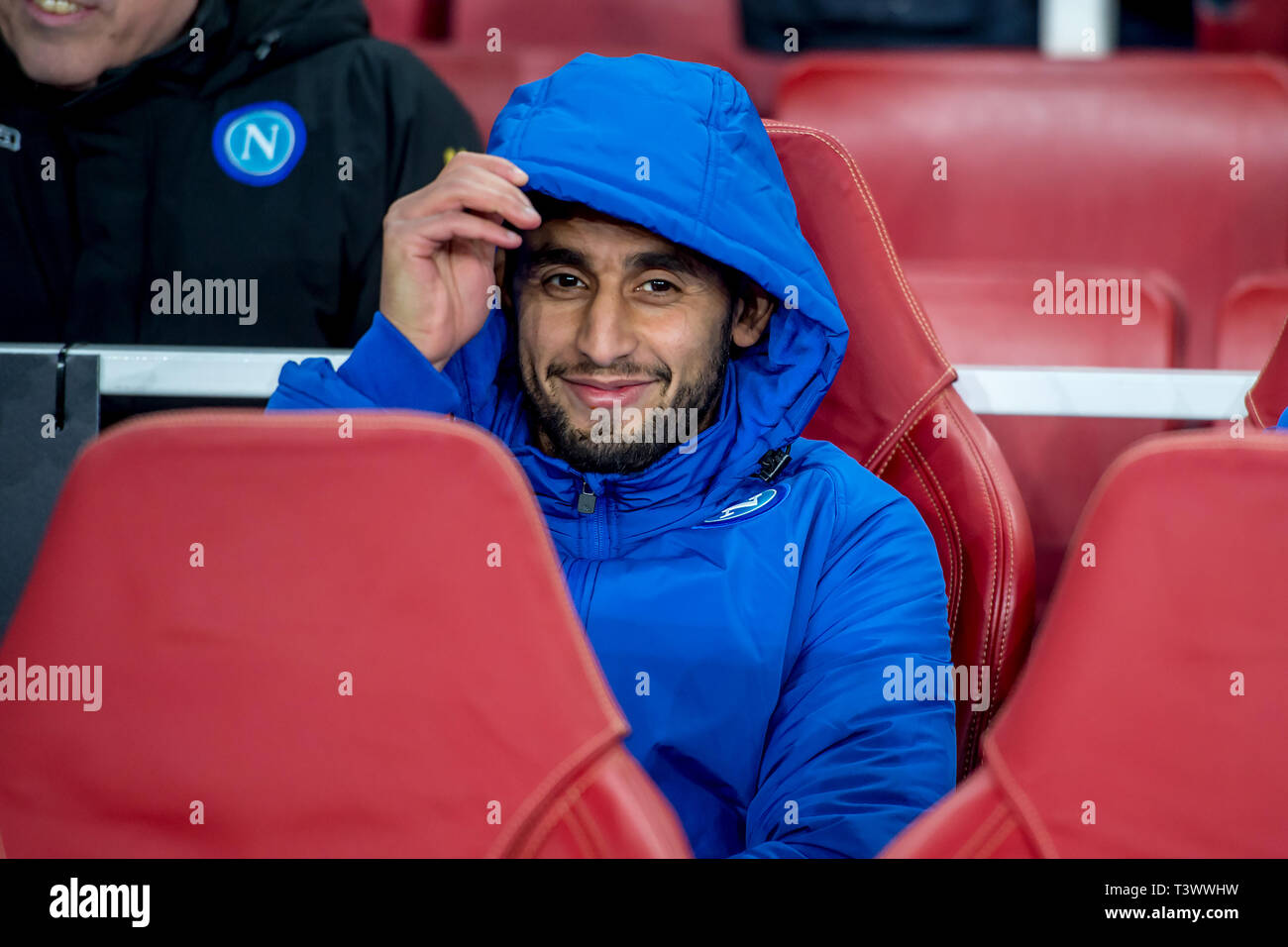 London, UK. 11th Apr, 2019. Faouzi Ghoulam of Napoli smiles on the bench during the UEFA Europa League Quarter Final match between Arsenal and Napoli at the Emirates Stadium, London, England on 11 April 2019. Photo by Salvio Calabrese. Editorial use only, license required for commercial use. No use in betting, games or a single club/league/player publications. Credit: UK Sports Pics Ltd/Alamy Live News Stock Photo