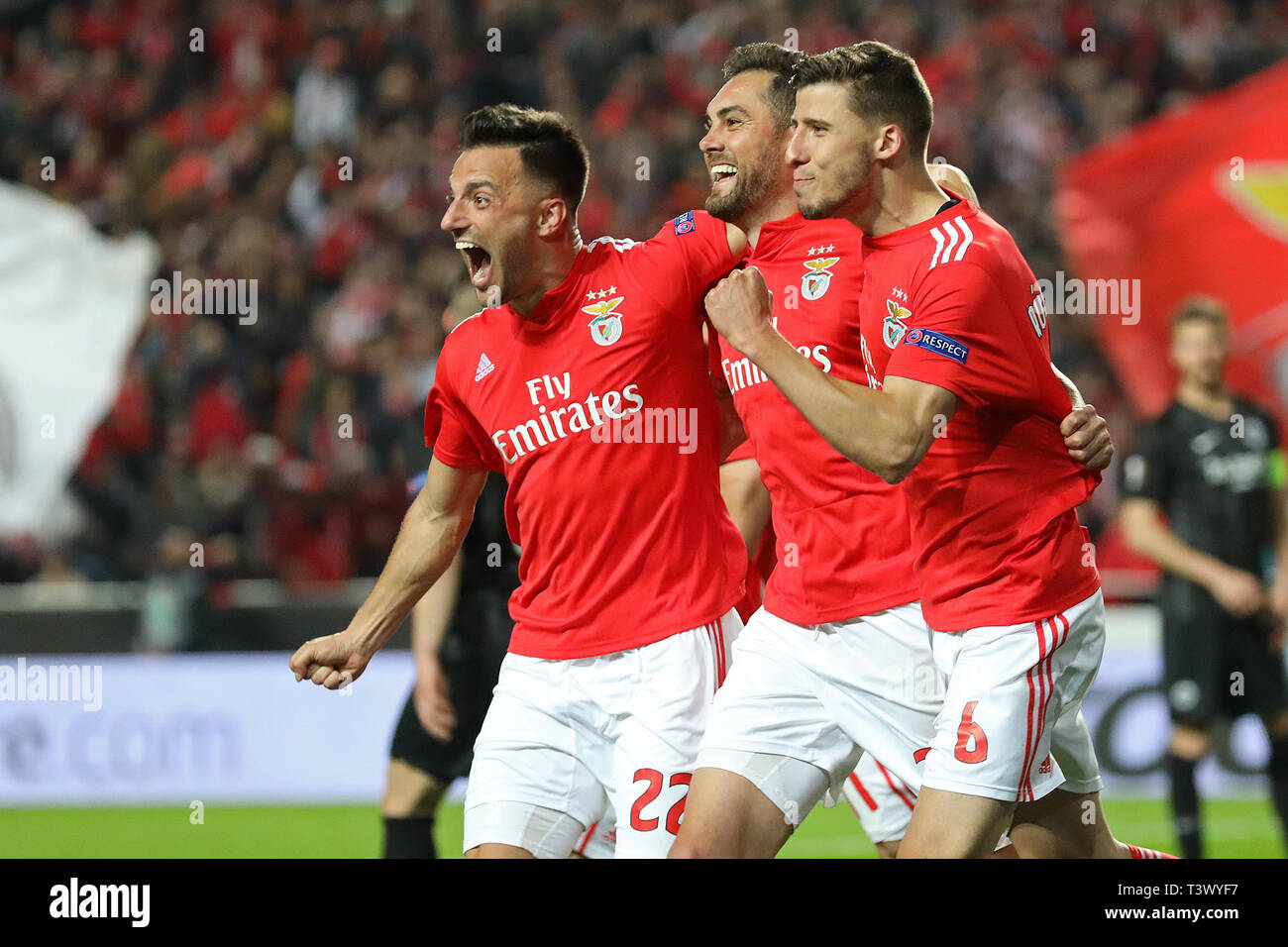 Rúben Dias of SL Benfica (R) celebrates his goal with Andreas Samaris of SL Benfica (L) and Jardel of SL Benfica (C) during the UEFA Europa League 2018/2019 football match between SL Benfica vs Eintracht Frankfurt.  (Final score: SL Benfica 4 - 2 Eintracht Frankfurt) Stock Photo