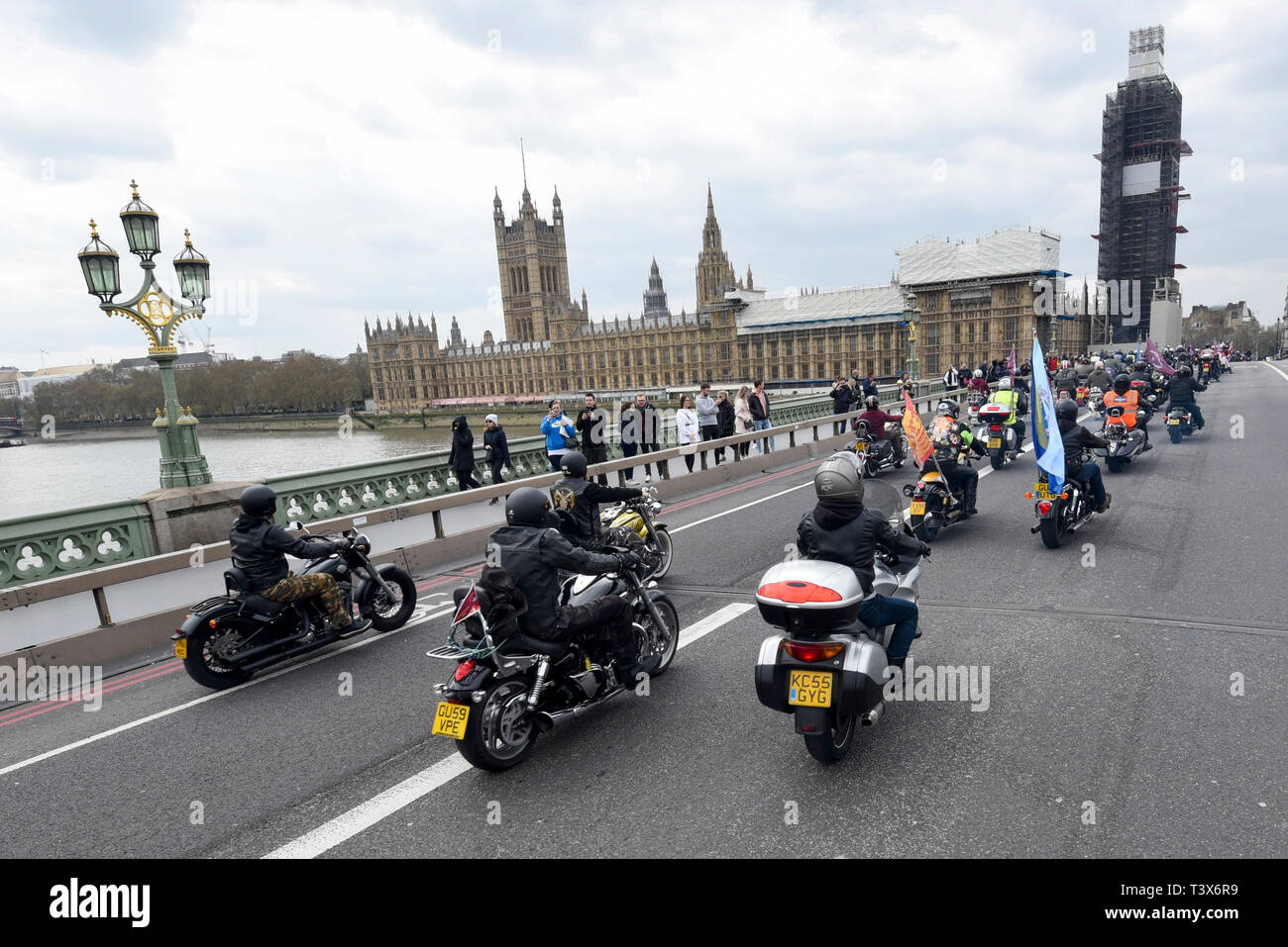 London, UK. 12th Apr 2019.Bikers cross Westminster Bridge.  Thousands of bikers take part in a rally called 'Rolling Thunder' in central London in support of 'Soldier F, a 77-year-old Army veteran who faces charges of murder after killing two civil rights demonstrators in Londonderry, Northern Ireland, in 1972, on what became known as Bloody Sunday. Credit: Stephen Chung/Alamy Live News Stock Photo
