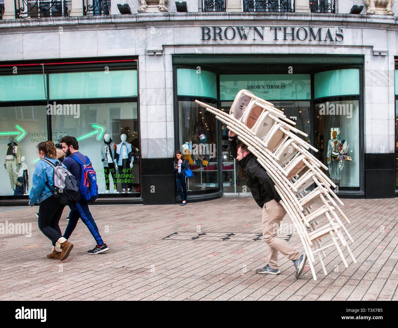 Cork City, Cork, Ireland. 12th April, 2019. David O' Driscoll, Kilkully carrying chairs down Patrick's Street for delivery to the Brown Thomas department Store in Cork, Ireland. Credit: David Creedon/Alamy Live News Stock Photo