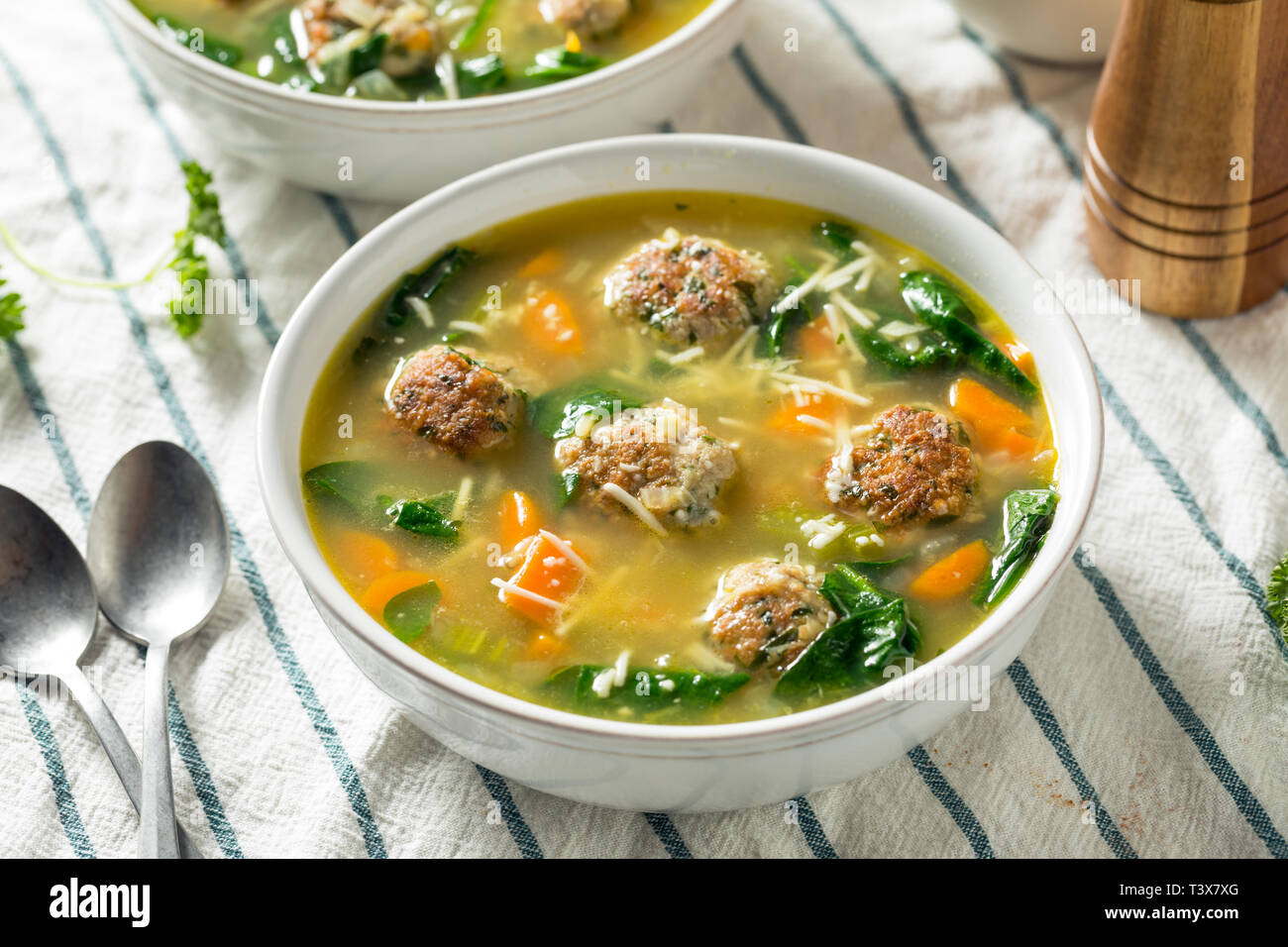 Homemade Italian Wedding Soup with Spinach and Meatballs Stock Photo