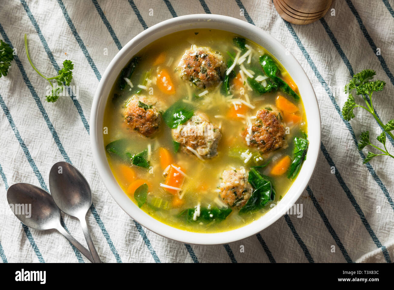 Homemade Italian Wedding Soup with Spinach and Meatballs Stock Photo