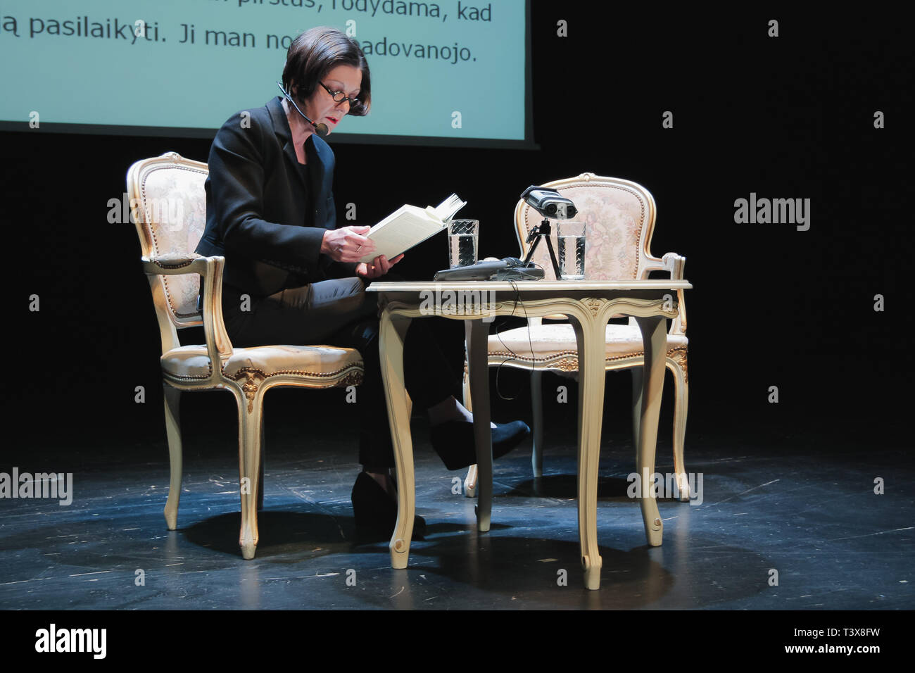 Vilnius Lithuania - April 11 2011 Herta Muller is reading her book on theater stage. Stock Photo