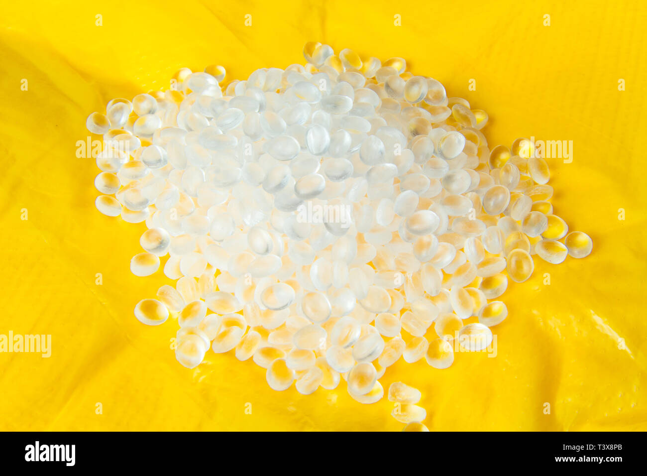 Transparent Polyethylene granules on plastic polyethylene film . HDPE