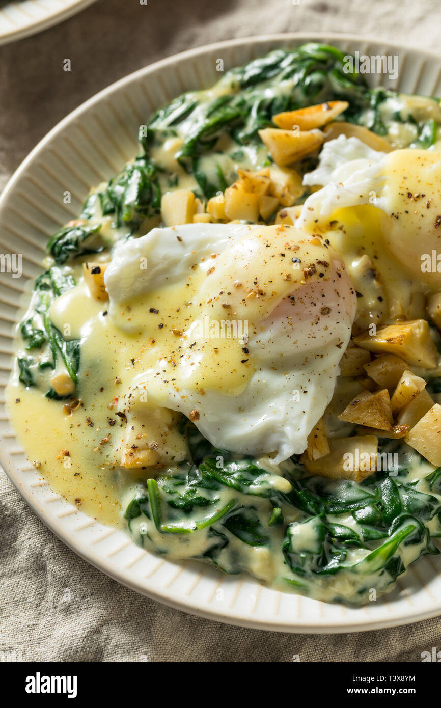 Homemade Cajun Eggs Sardou with Artichoke and Spinach Stock Photo Alamy