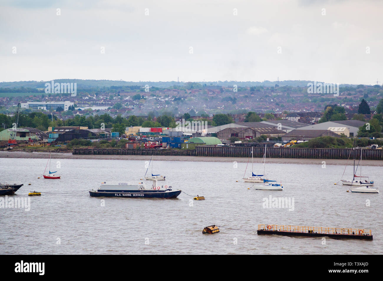 Gravesend, Kent, UK. A view from the river Thames looking over the industrial  area of East Gravesend. Boats and other marine shipping can be seen. Stock Photo