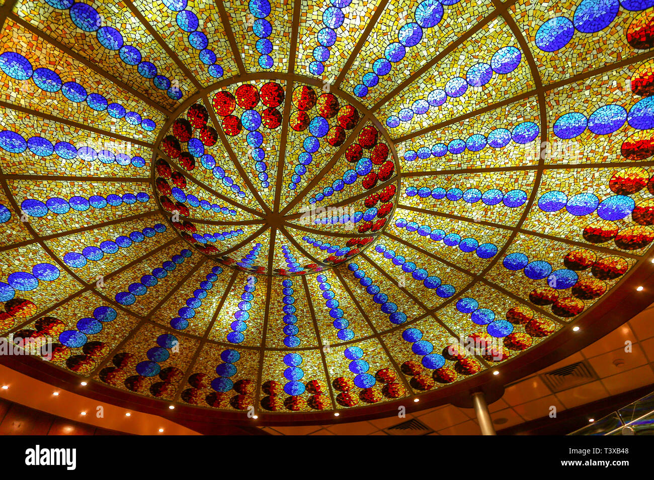 An ornate ceiling and lighting in a cruise ship Stock Photo