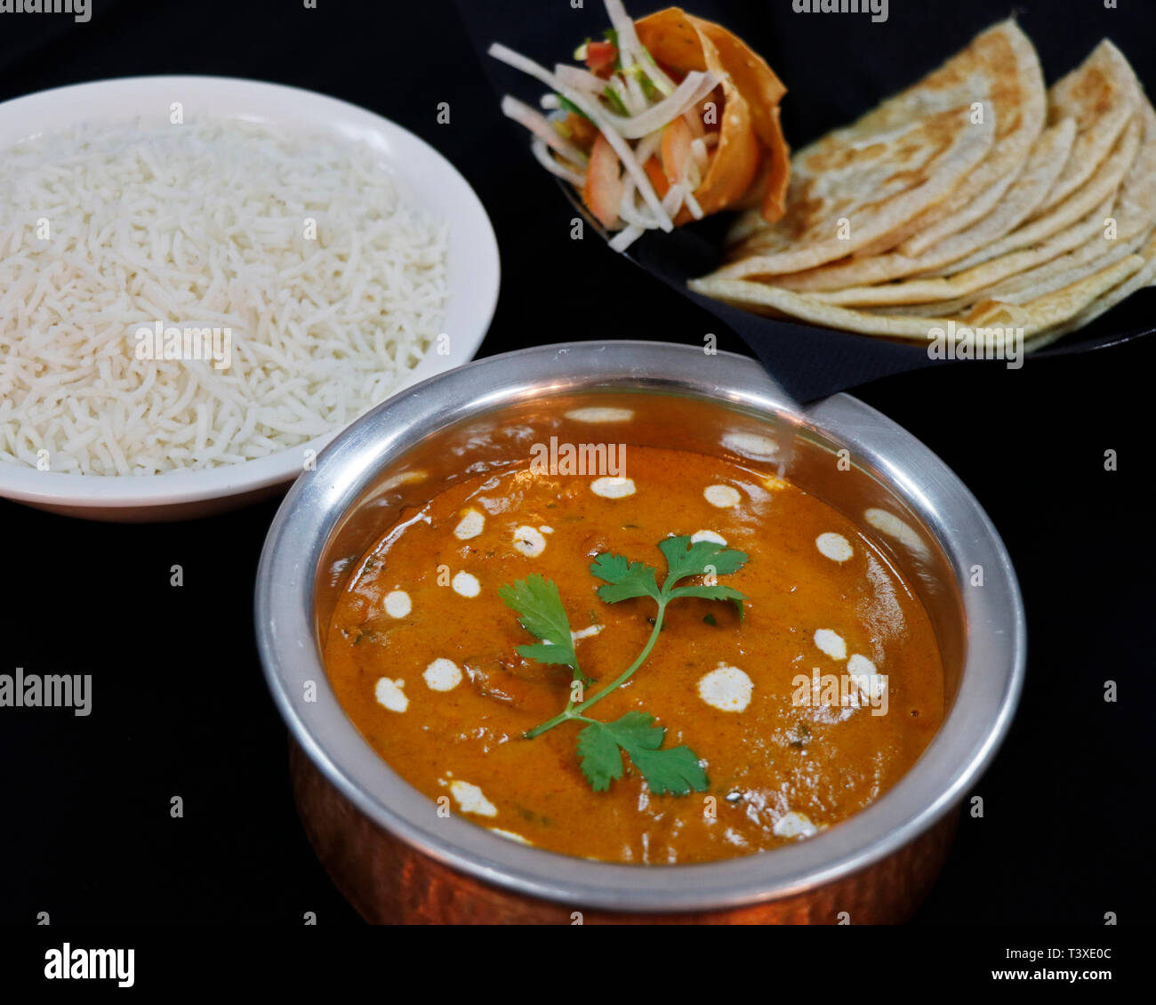 butter chicken curry with basmati rice and Indian bread Stock Photo Alamy