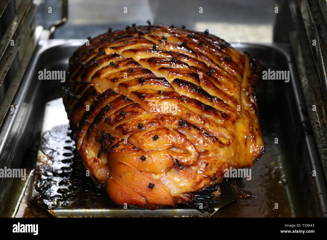 slow roasted gammon in the oven Stock Photo Alamy
