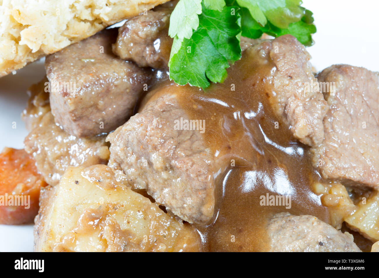 A classic plate of Beef stew served with a suet dumpling Stock Photo