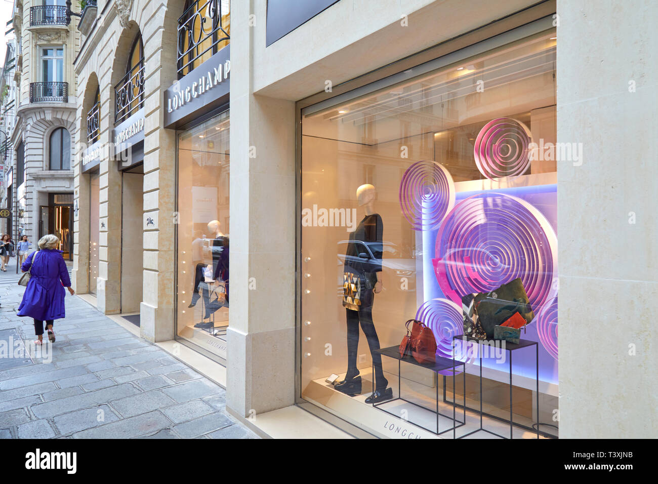 PARIS, FRANCE - JULY 22, 2017: Longchamp fashion luxury store in Paris, people passing, France. Stock Photo