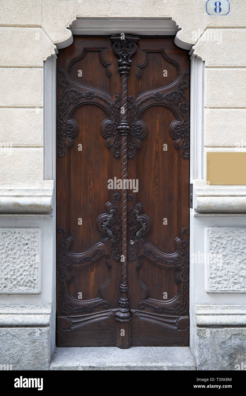TURIN, ITALY - SEPTEMBER 10, 2017: Art Nouveau ancient wooden door with floral decorations in Turin, Italy Stock Photo