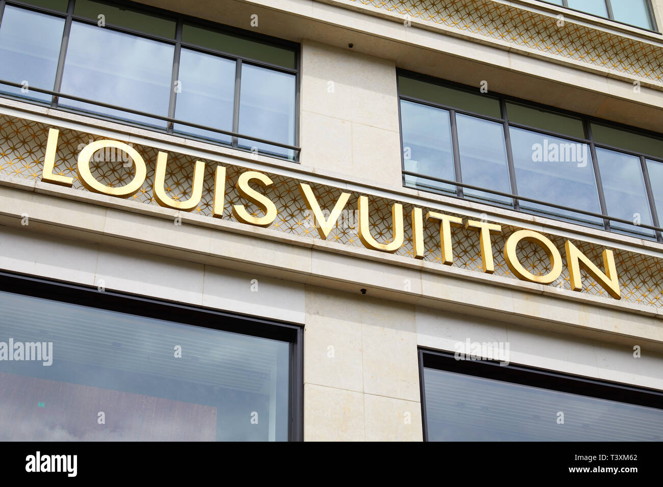 PARIS, FRANCE - JULY 22, 2017: Louis Vuitton fashion luxury store golden sign in Paris, France. Stock Photo