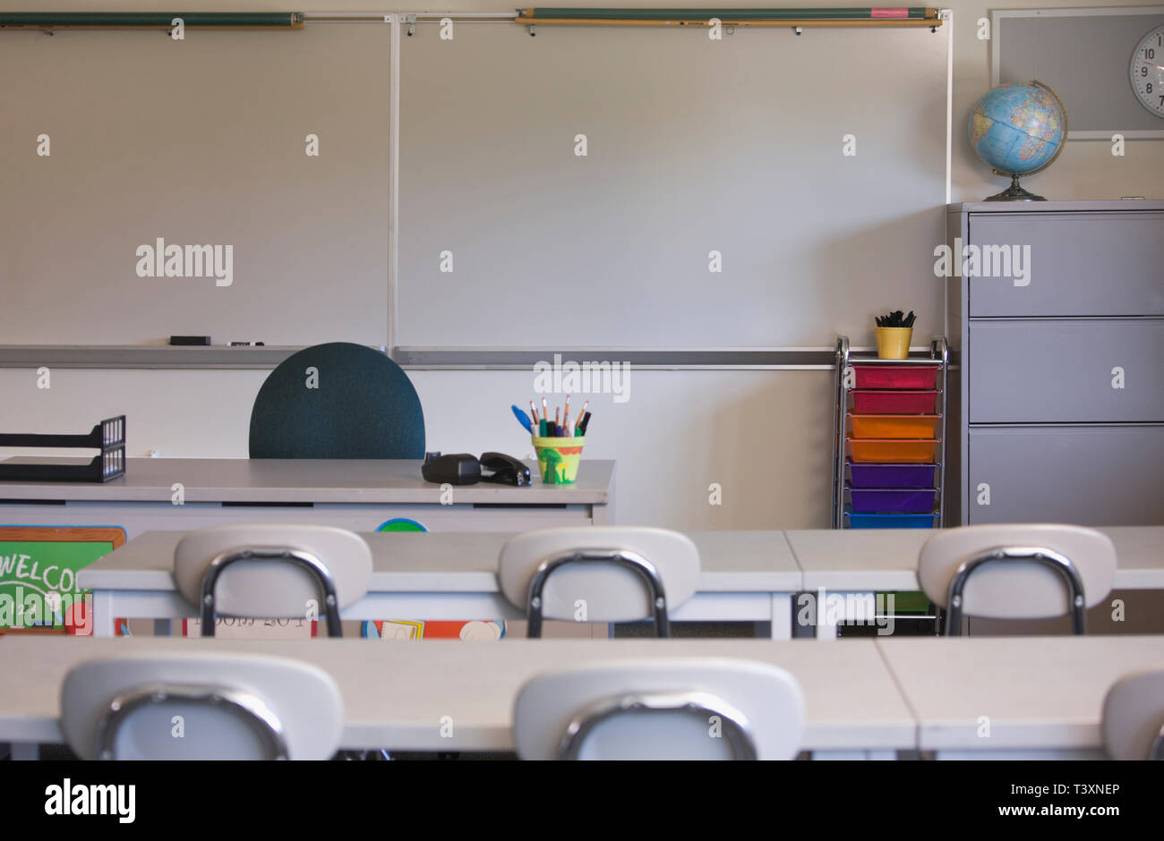 Empty desks in classroom Stock Photo