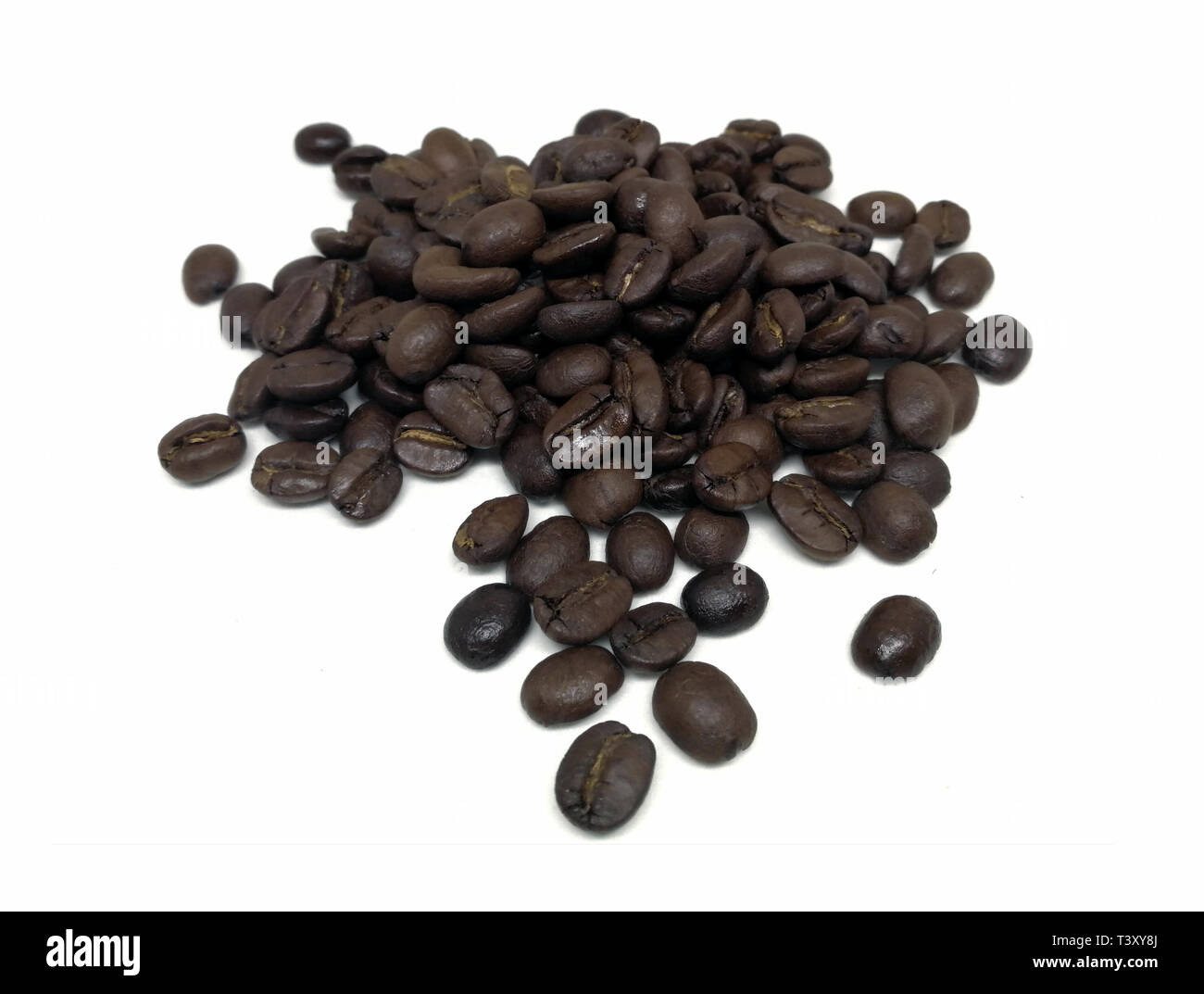 roasted coffee beans isolated in white background Stock Photo - Alamy