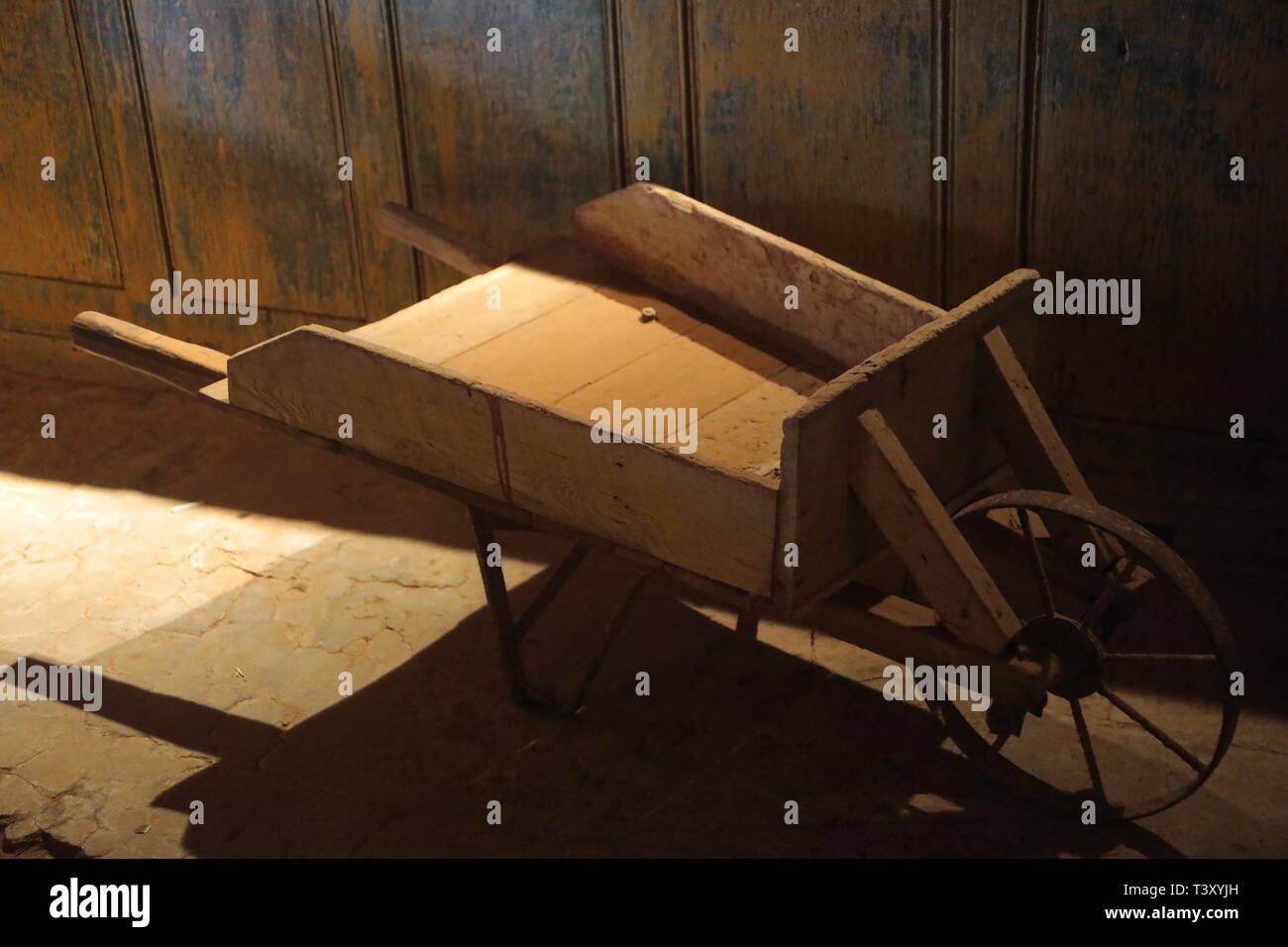 Wooden wheelbarrow Stock Photo
