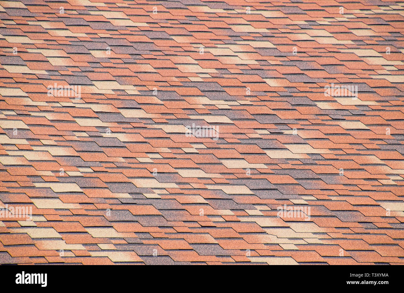 Roof from multicolored bituminous shingles. Patterned bitumen shingles