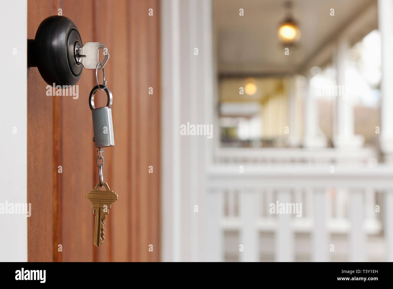 Key in front door Stock Photo - Alamy