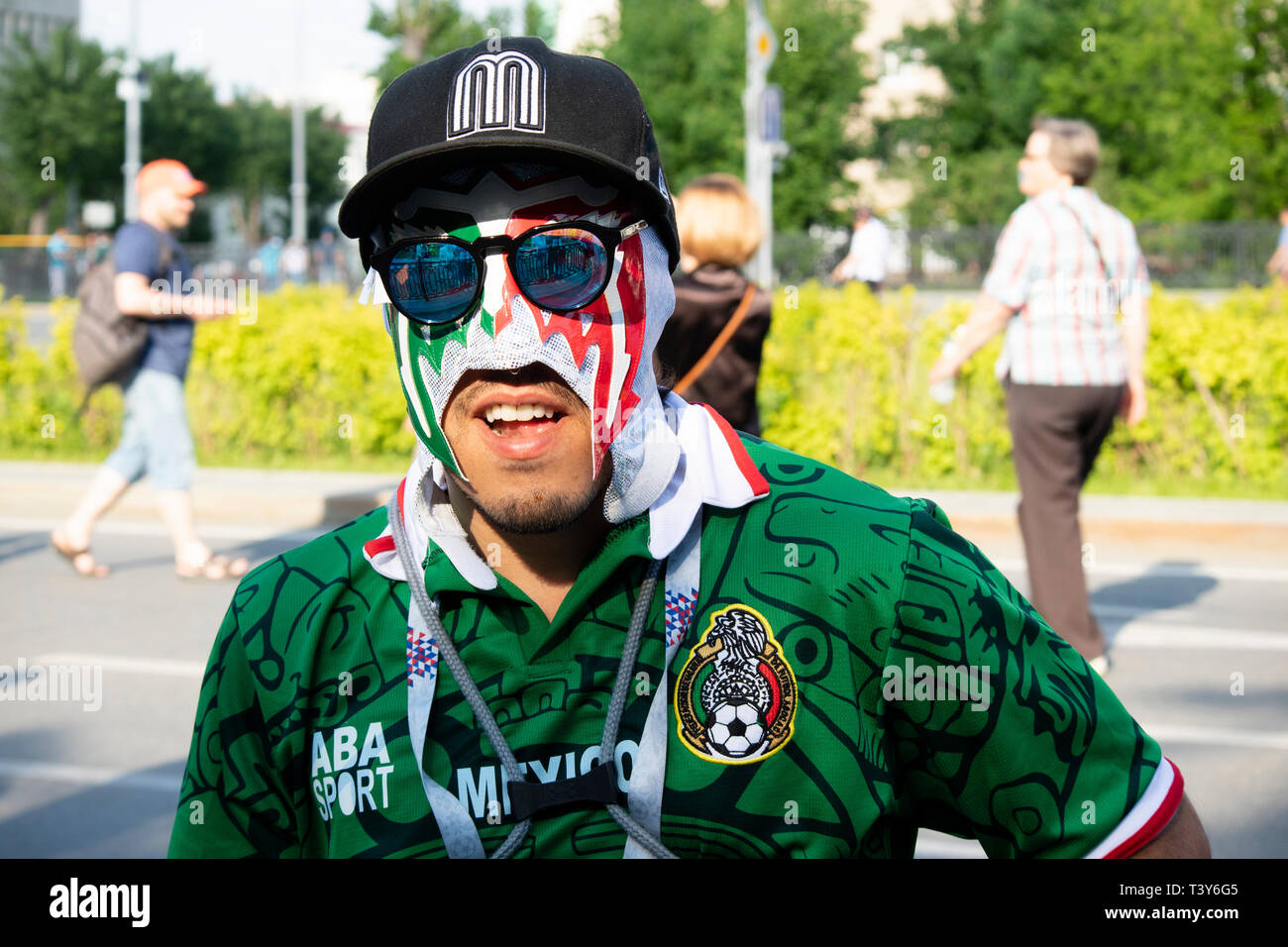 Mexican fan with Mexican wrestling mask, baseball hat and sunglasses looking to camera - FIFA World Cup Russia 2018 Mexico v Sweden, Ekaterinburg Stock Photo