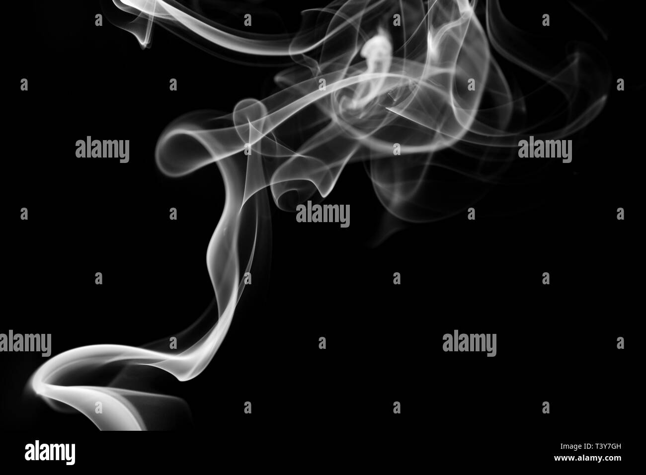 White smoke swirls on a black background Stock Photo