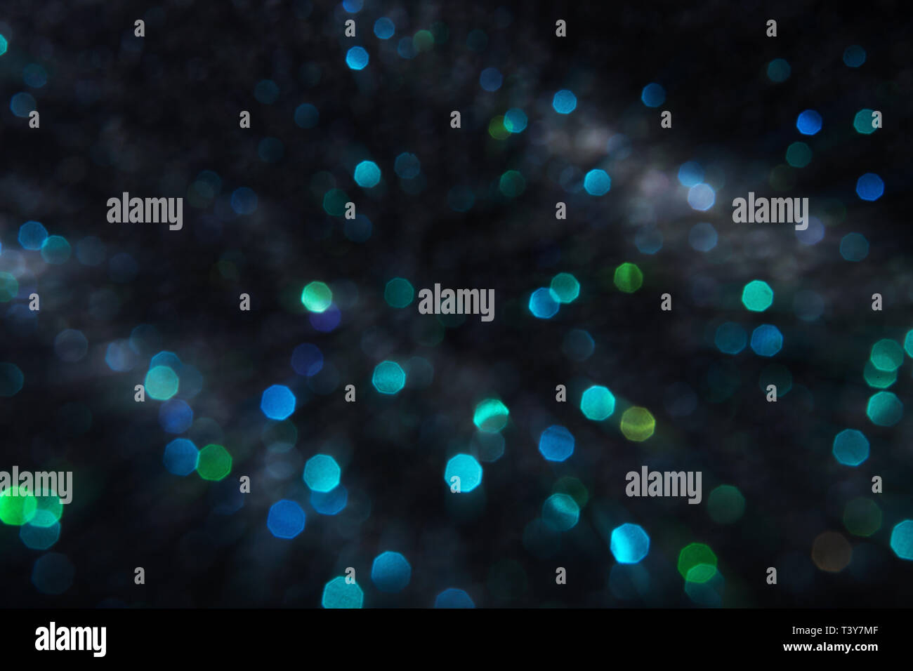 Blue and green bokeh lights on a black background Stock Photo - Alamy
