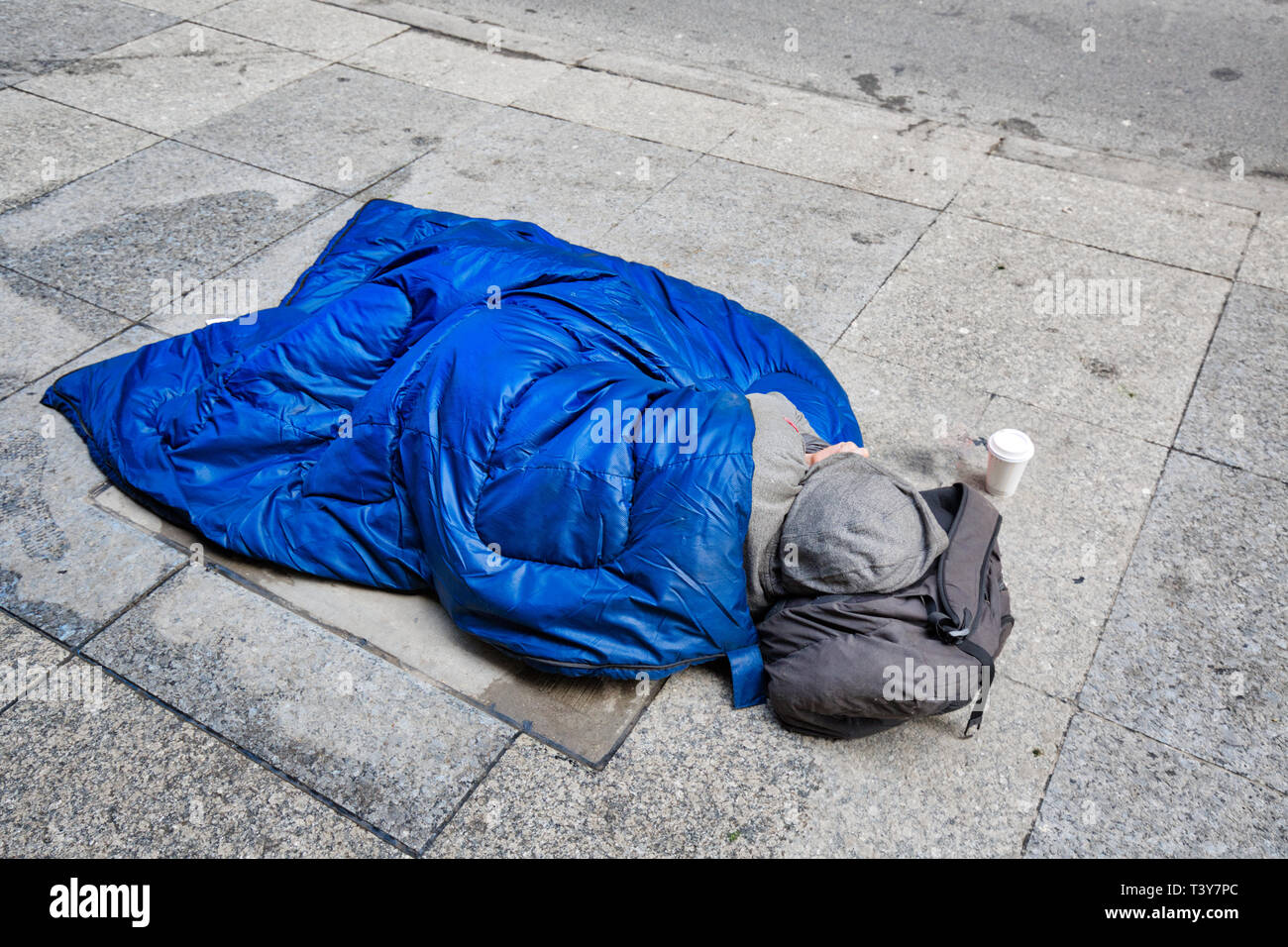 Homeless Man Lying On The Street Near Nathan Phillips Square In Toronto Downtown Stock Photo Alamy