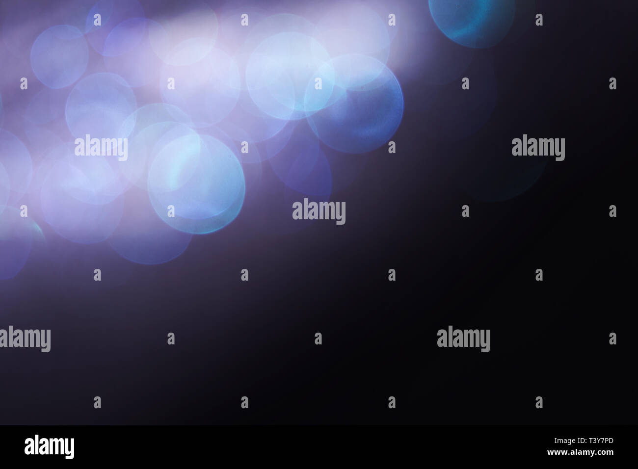 Blue and green bokeh lights on a black background Stock Photo - Alamy