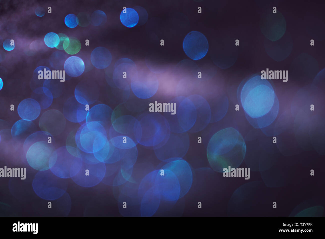 Blue and green bokeh lights on a black background Stock Photo - Alamy