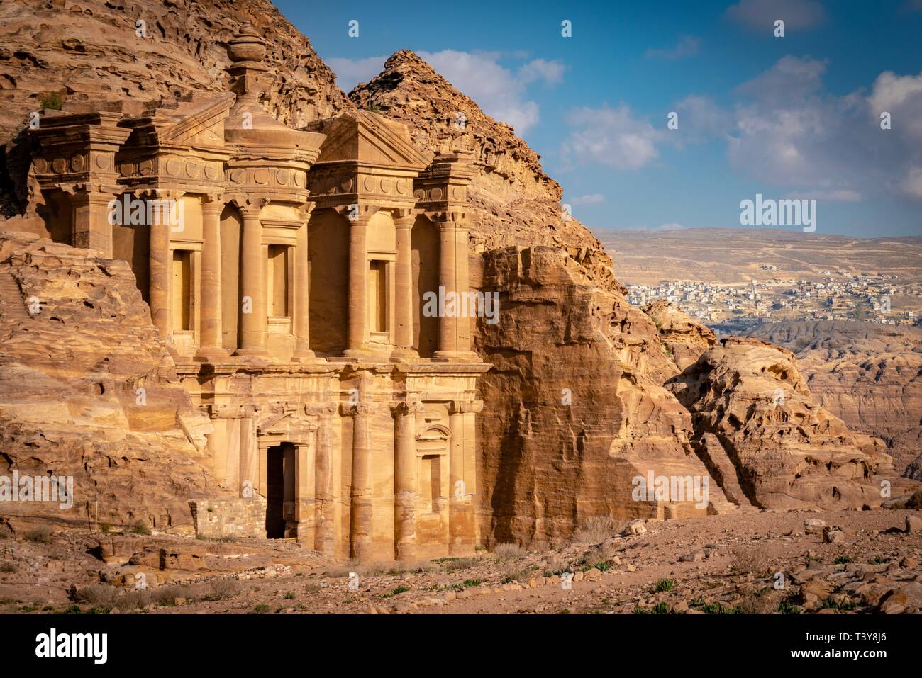 Ad Deir ('The Monastery'; Arabic: الدير ), also known as El Deir, is a monumental building carved out of rock in the ancient Jordanian city of Petra. Stock Photo