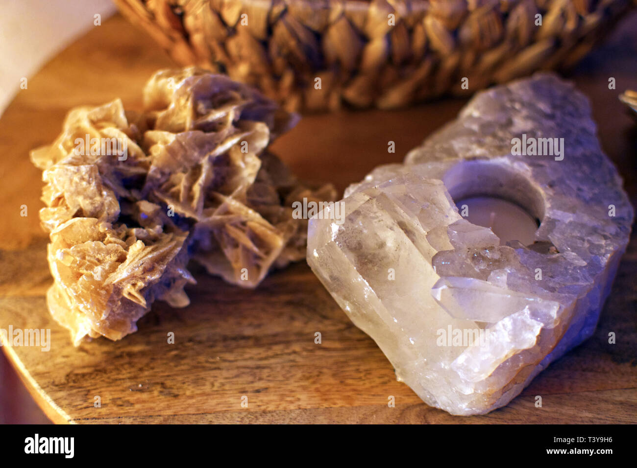 rock crystal tealightholder and desert rose on a table closeup macro Stock Photo