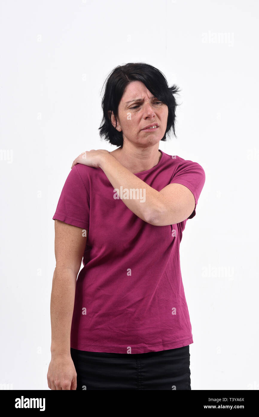 woman with pain on shoulder on white background Stock Photo