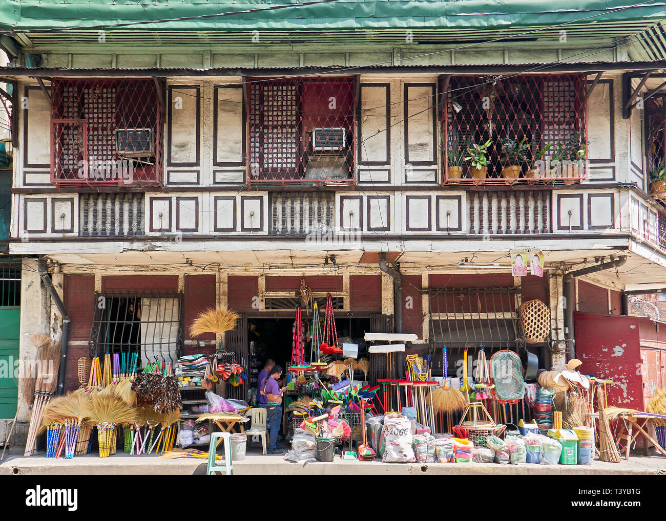 Manila, Philippines: Facade of an old historical wooden building with a shop, Binondo, near the Pasig River, Manila Stock Photo