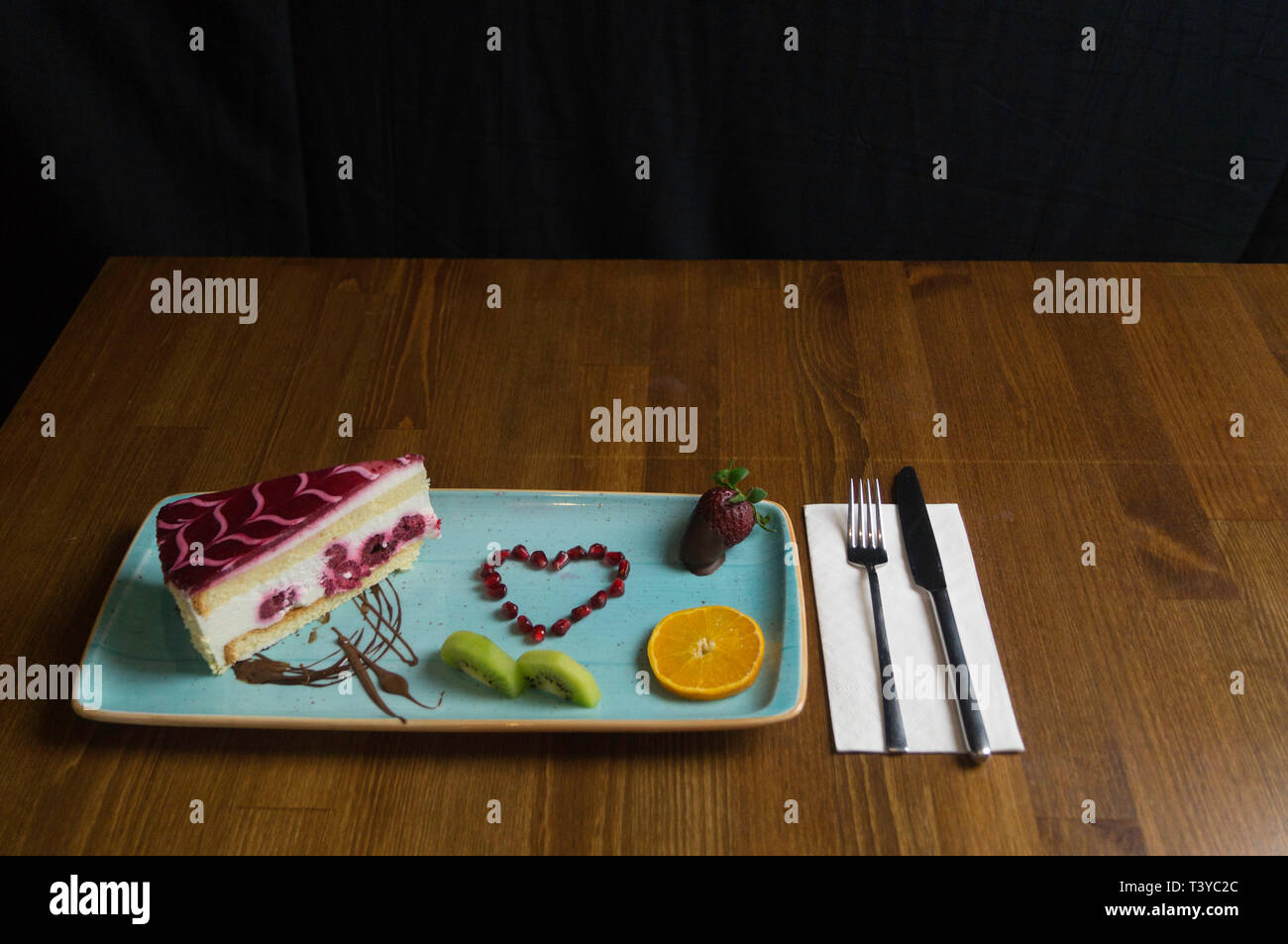 In carefully crafted serving tray cake and sweets Stock Photo Alamy