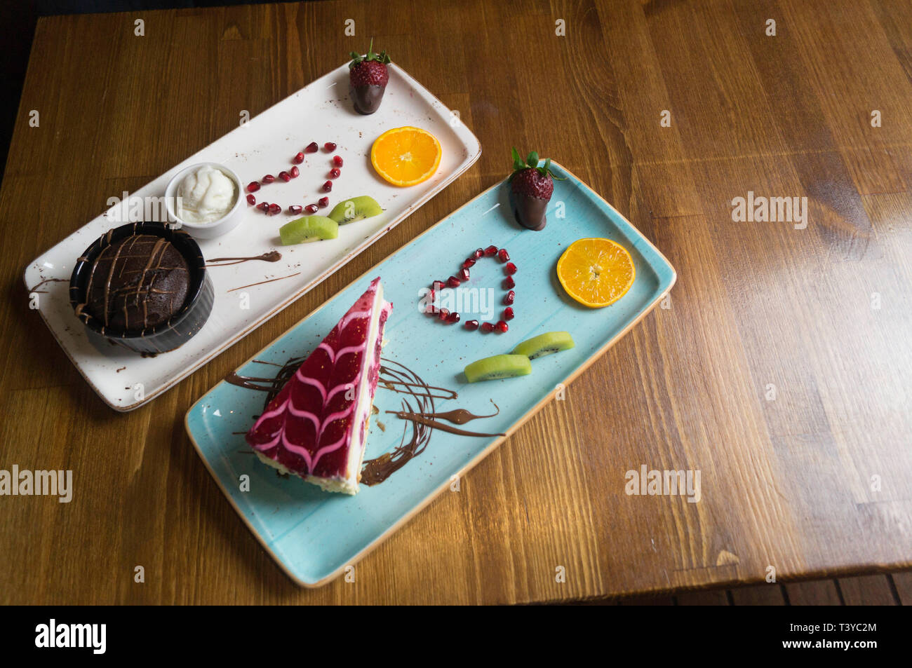 In carefully crafted serving tray cake and sweets Stock Photo Alamy