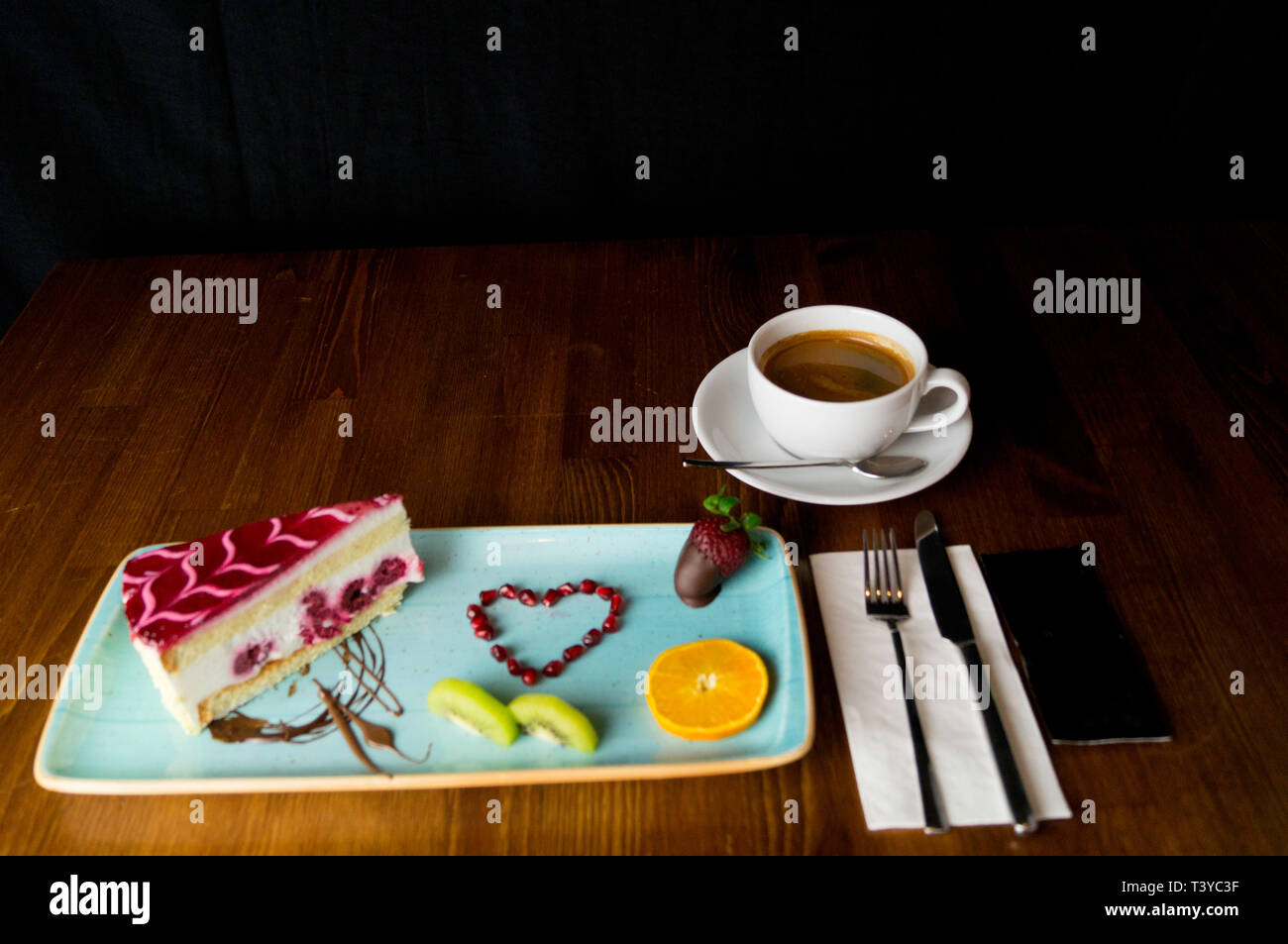 In carefully crafted serving tray cake and sweets Stock Photo Alamy