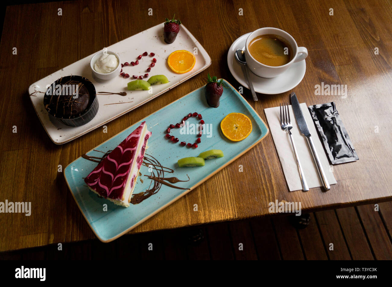 In carefully crafted serving tray cake and sweets Stock Photo
