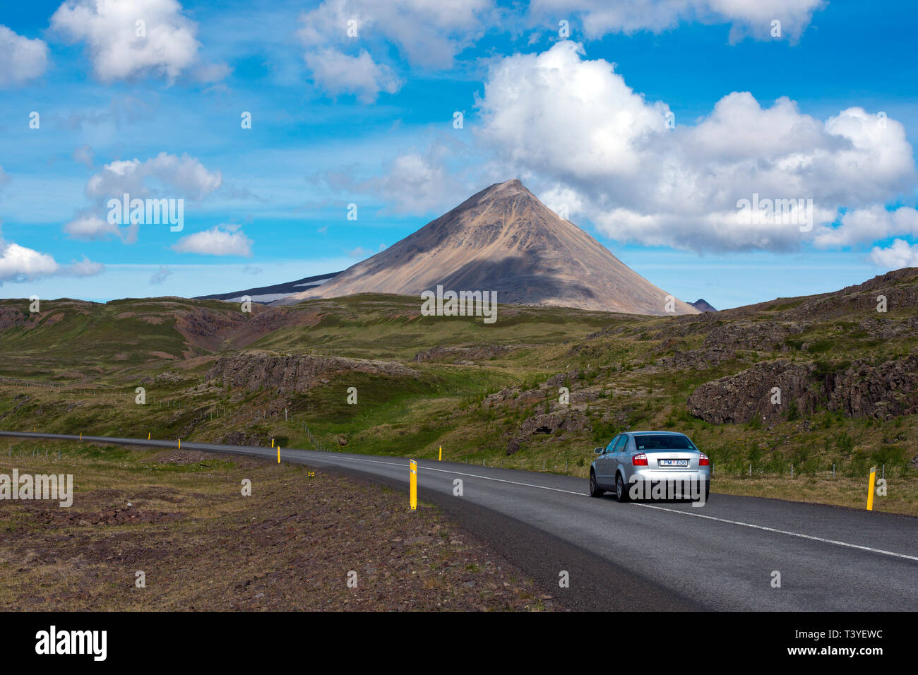 Car passing the Baula mountain as seen from route 60, Western Region, Iceland.Iceland Stock Photo