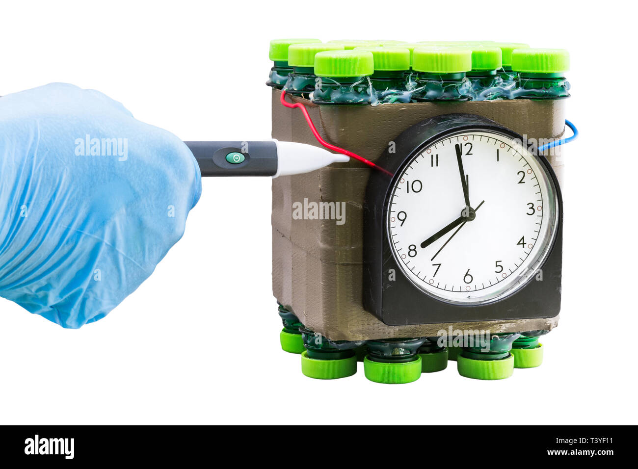 Time bomb disposal expert.Dummy weapon. Human hand in blue glove holding wireless tester. Dangerous explosive device deactivation. Terrorism, violence. Stock Photo