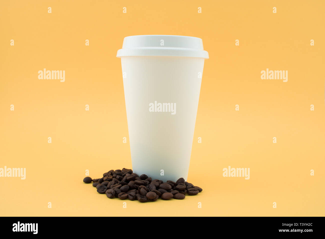 Download Paper Coffee Cup On Coffee Beans Yellow Background The Coffee Cup Is Covered With The Lid Stock Photo Alamy Yellowimages Mockups