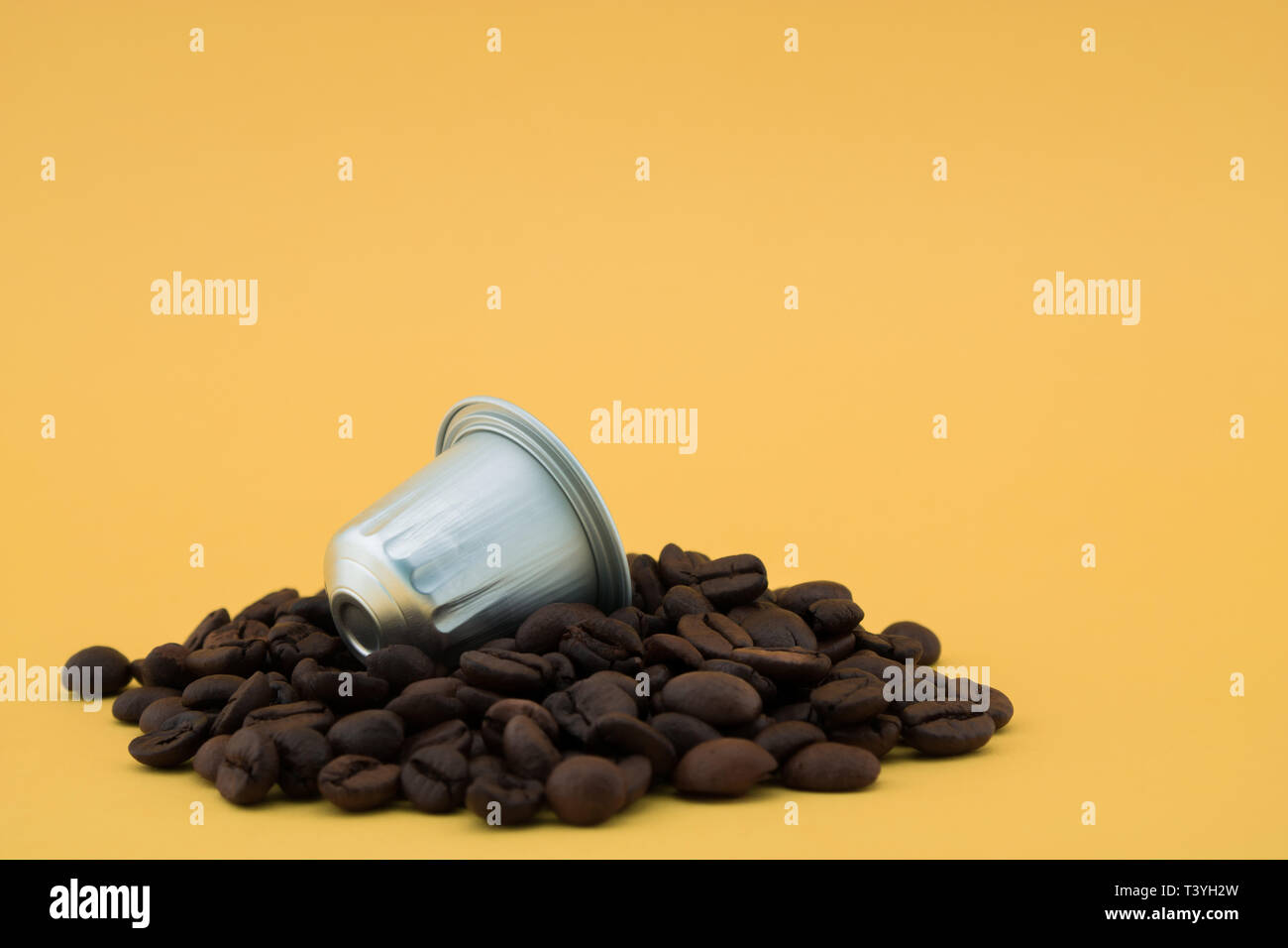 Download Coffee Capsule Or Coffee Pod On Coffee Beans Yellow Background Capsules For Coffee Machine Stock Photo Alamy Yellowimages Mockups
