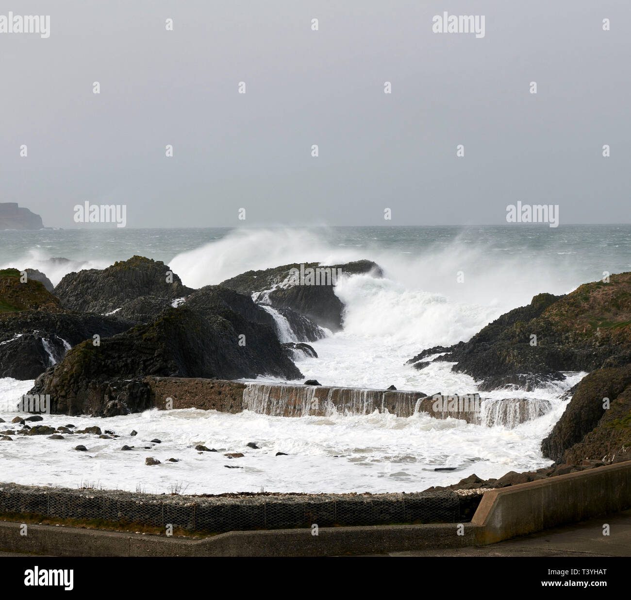Stormy seas at Ballintoy Harbour, North Antrim Coast, Northern Ireland, UK Stock Photo