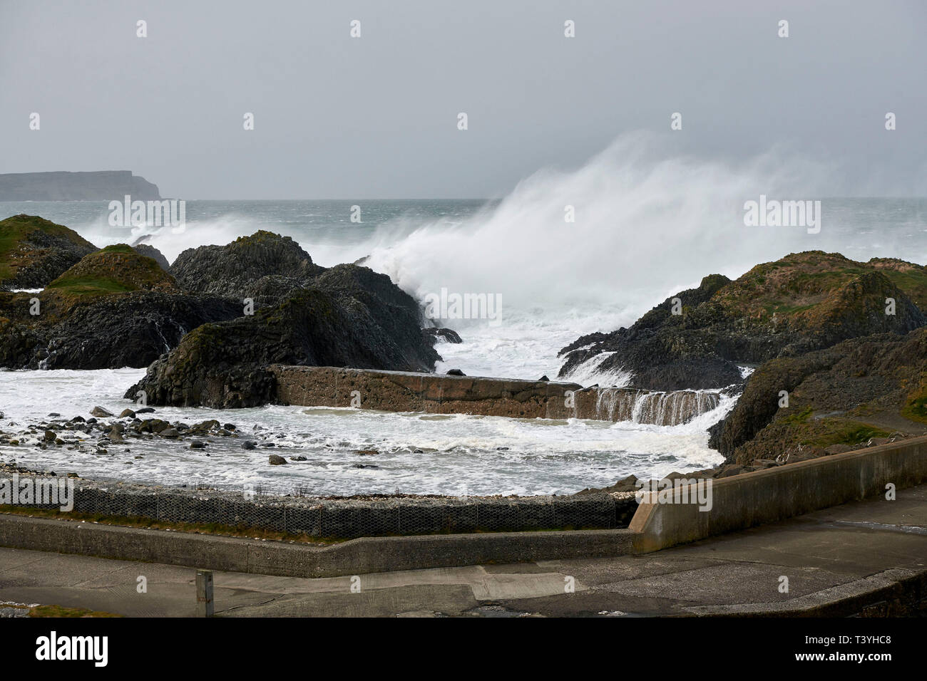 Stormy seas at Ballintoy Harbour, North Antrim Coast, Northern Ireland, UK Stock Photo