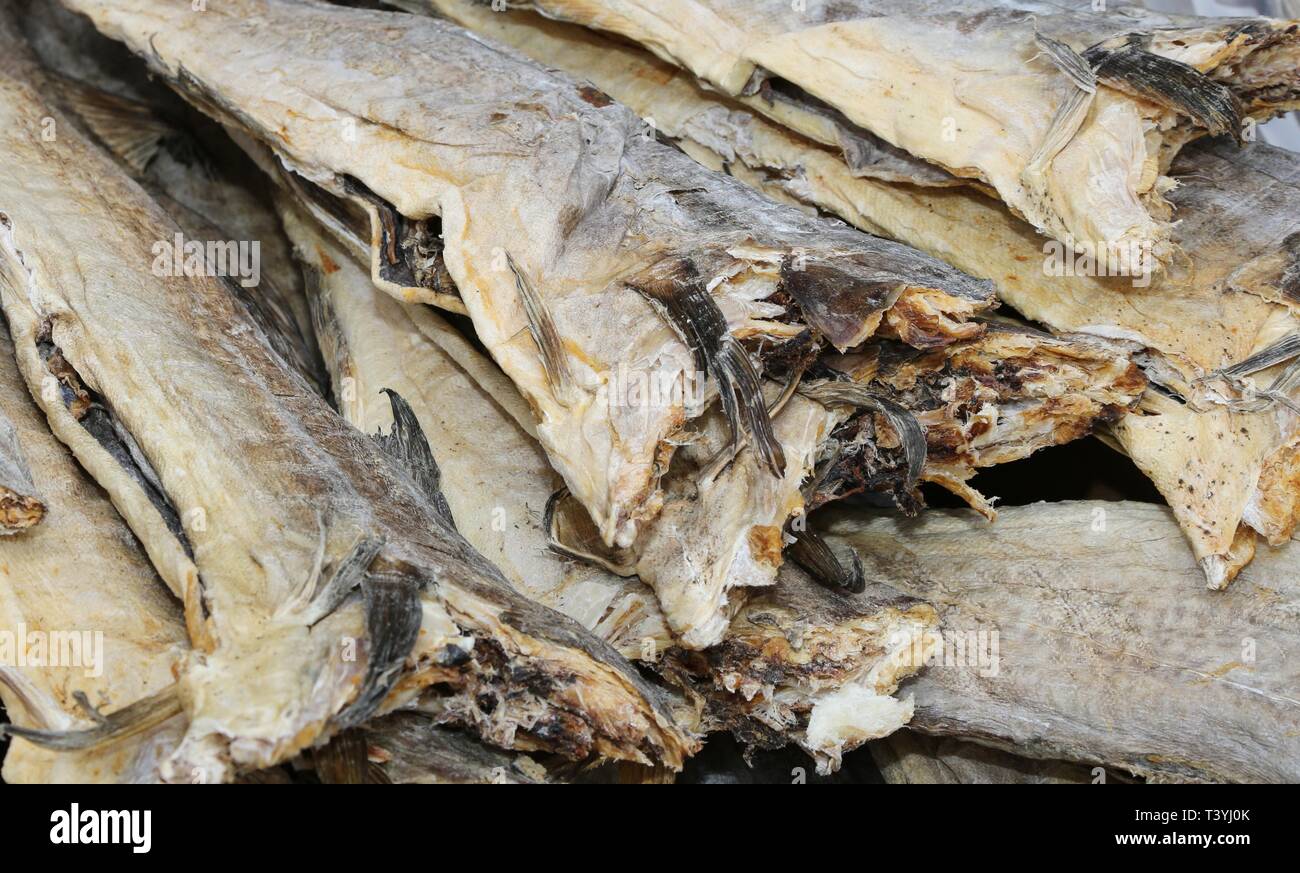 dried Smoked Stockfish cod fish for sale at the fish market Stock Photo