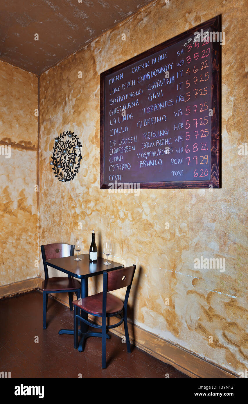 Blackboard and table in wine bar Stock Photo