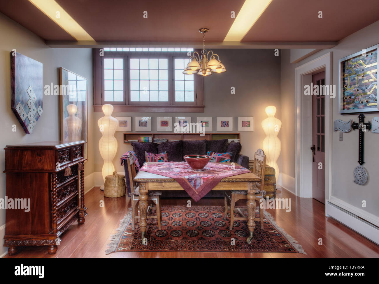 Table, drawers and sofa in living room Stock Photo - Alamy