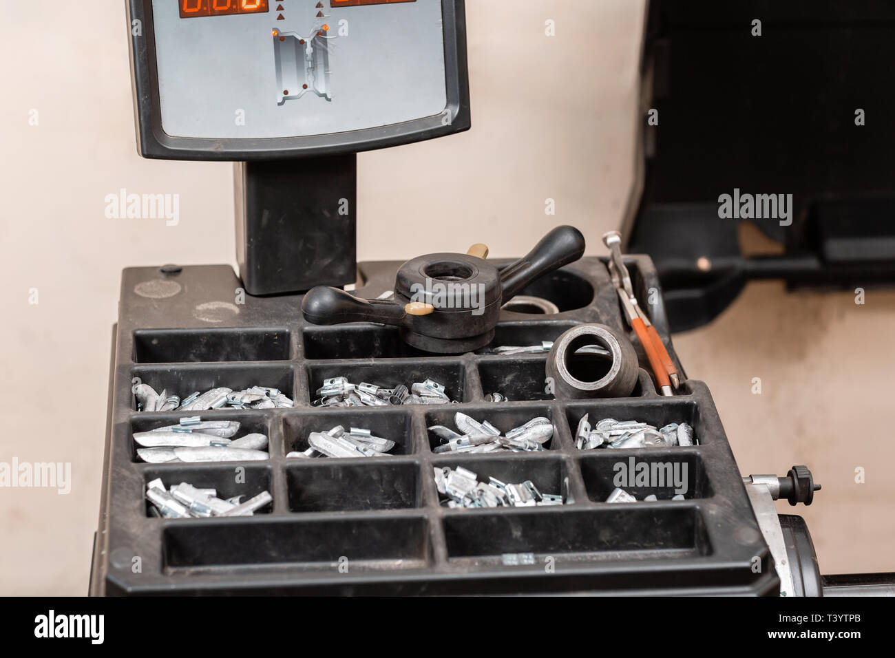 Car service. The tool for repair Lead small weights and pincers for