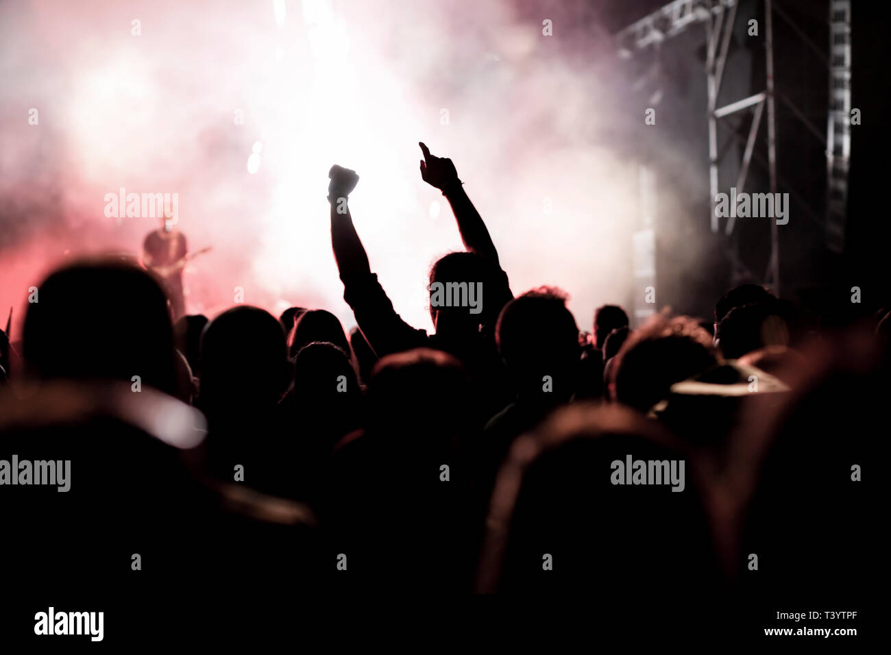 Crowd with raised up hands dancing in nightclub hi-res stock ...