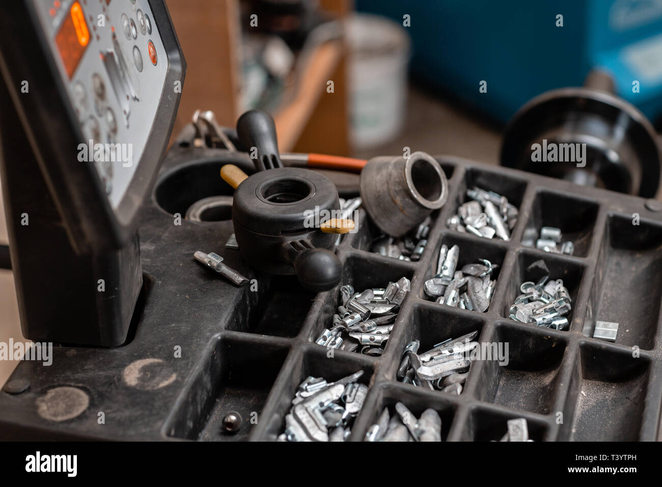 Car service. The tool for repair Lead small weights and pincers for