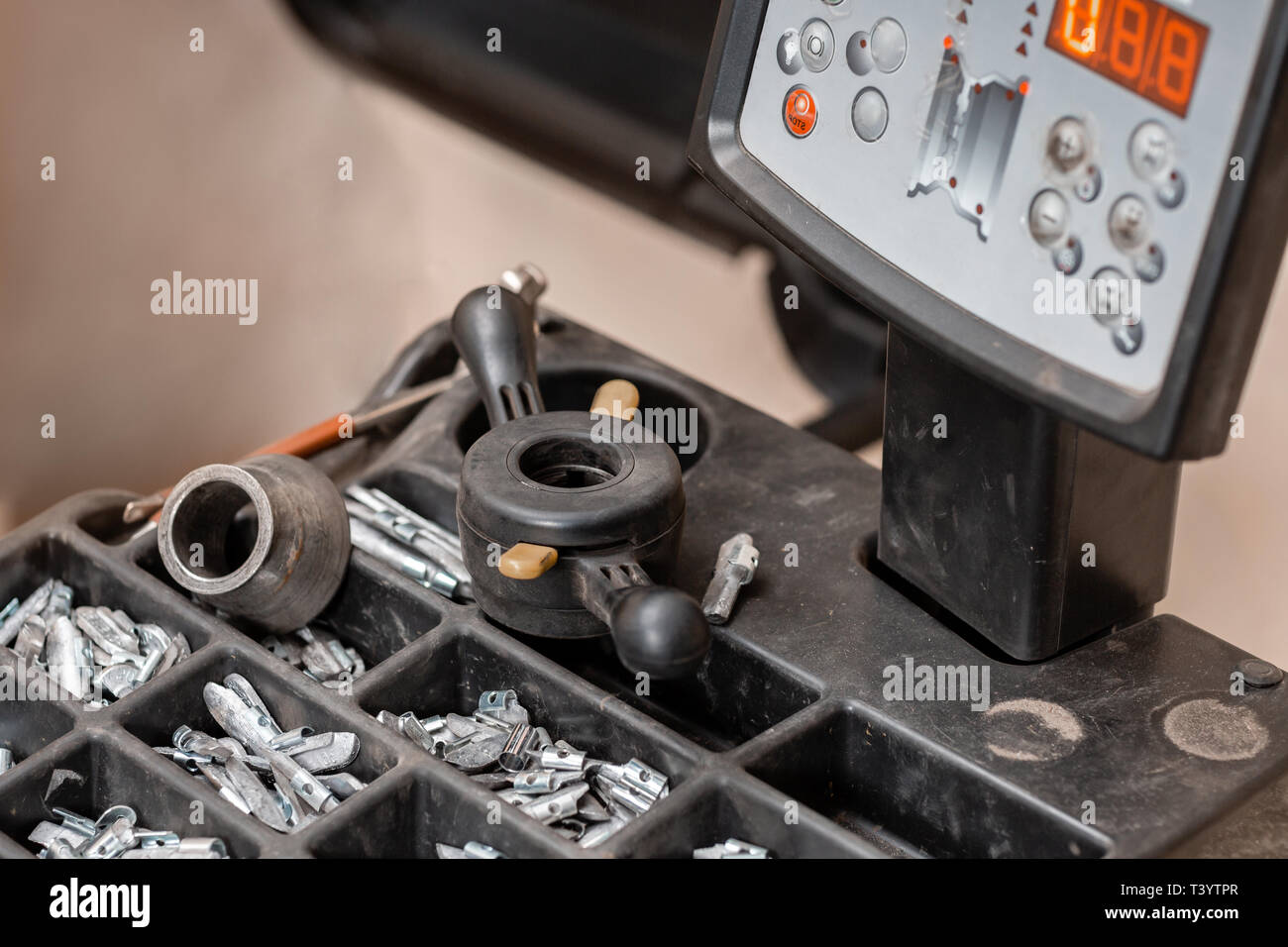 Car service. The tool for repair Lead small weights and pincers for